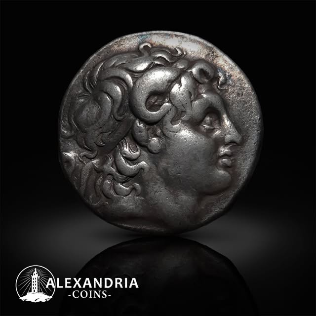 Ancient silver coin with horned portrait of Alexander